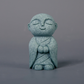 Mini fridfull Zen-munkfigurin