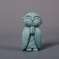 Mini fridfull Zen-munkfigurin
