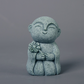 Mini fridfull Zen-munkfigurin