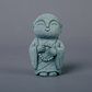 Mini fridfull Zen-munkfigurin