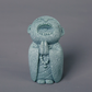 Mini fridfull Zen-munkfigurin